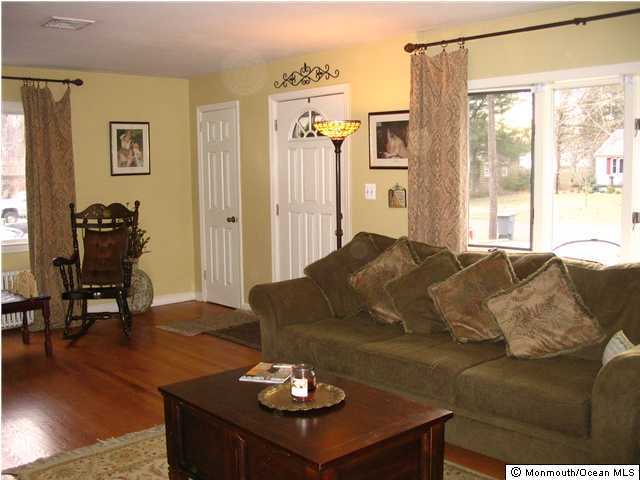 5 Spring Garden Road Lincroft, NJ 07738 - Photo 2 of 3 a living room with furniture and a table
