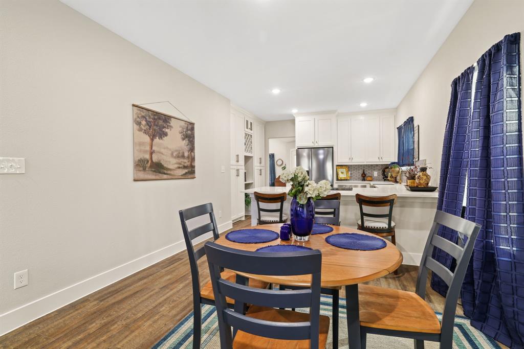 114 West Morton Street Denison, TX 75021 - Photo 5 of 22 a kitchen with a dining table chairs and refrigerator