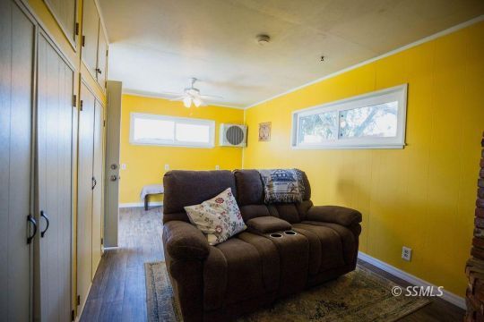 246 Peg Street Ridgecrest, CA 93555 - Photo 22 of 30 a living room with furniture and a large window