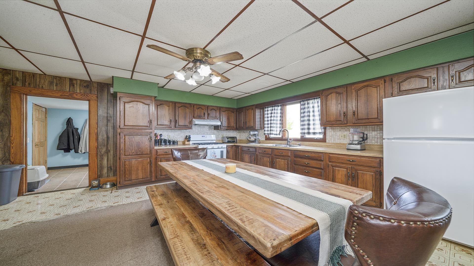 5014 South Farwell Bridge Road German Valley, IL 61039 - Photo 3 of 30 a outdoor kitchen with a stove a refrigerator and chandelier