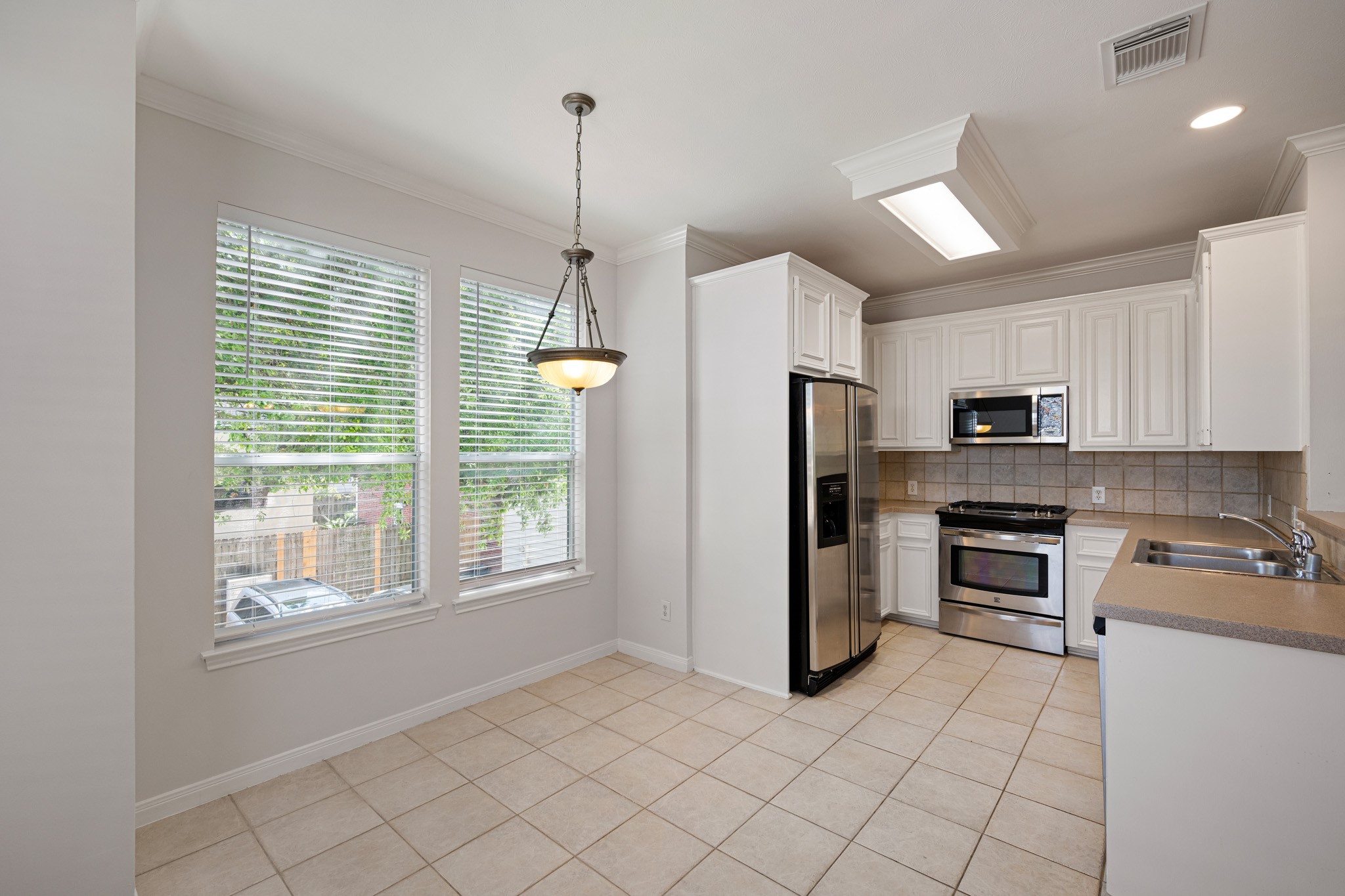 1727 Hadley Street Houston, TX 77003 - Photo 14 of 38 The kitchen is spacious and bright, featuring ample counter space, a convenient walk-in pantry, and plenty of storage—perfect for cooking, organizing, and entertaining.
