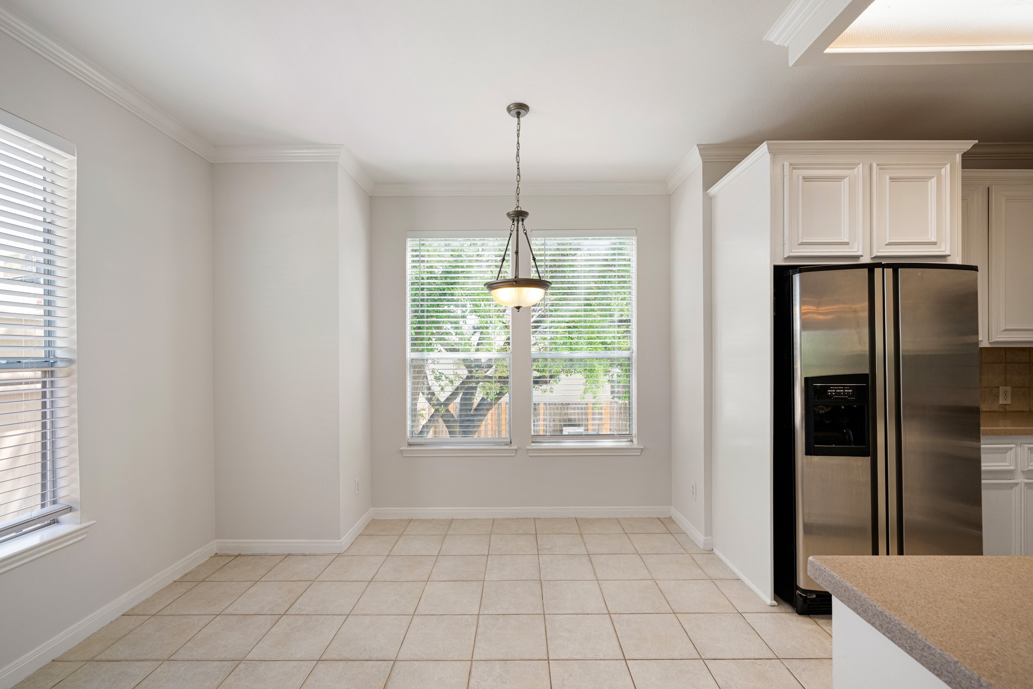 1727 Hadley Street Houston, TX 77003 - Photo 16 of 38 Kitchen and breakfast area features fresh paint, 2 inch blinds and crown molding.