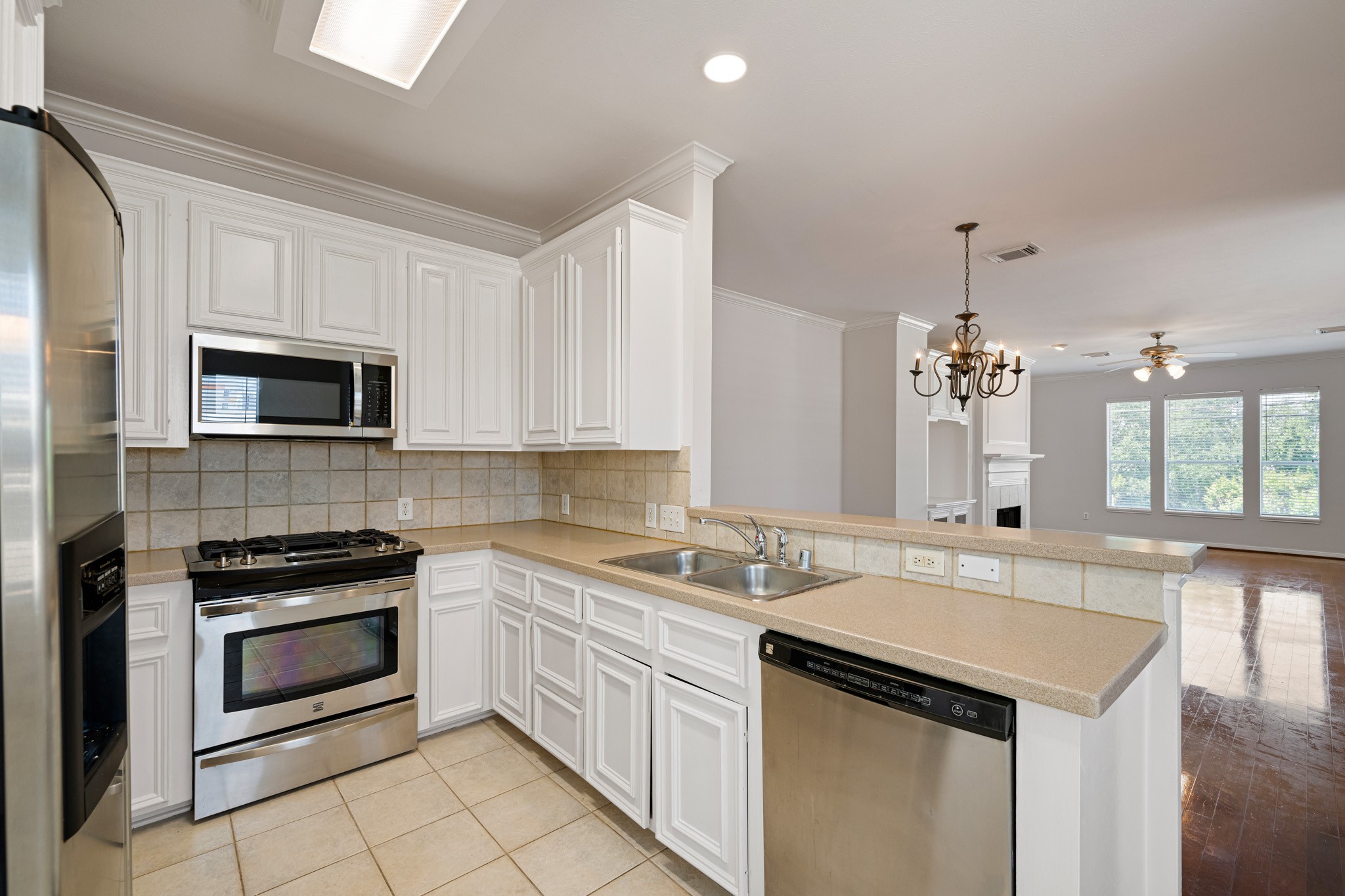 1727 Hadley Street Houston, TX 77003 - Photo 18 of 38 The kitchen flows seamlessly into the dining and family rooms, creating an ideal space for family gatherings and entertaining.