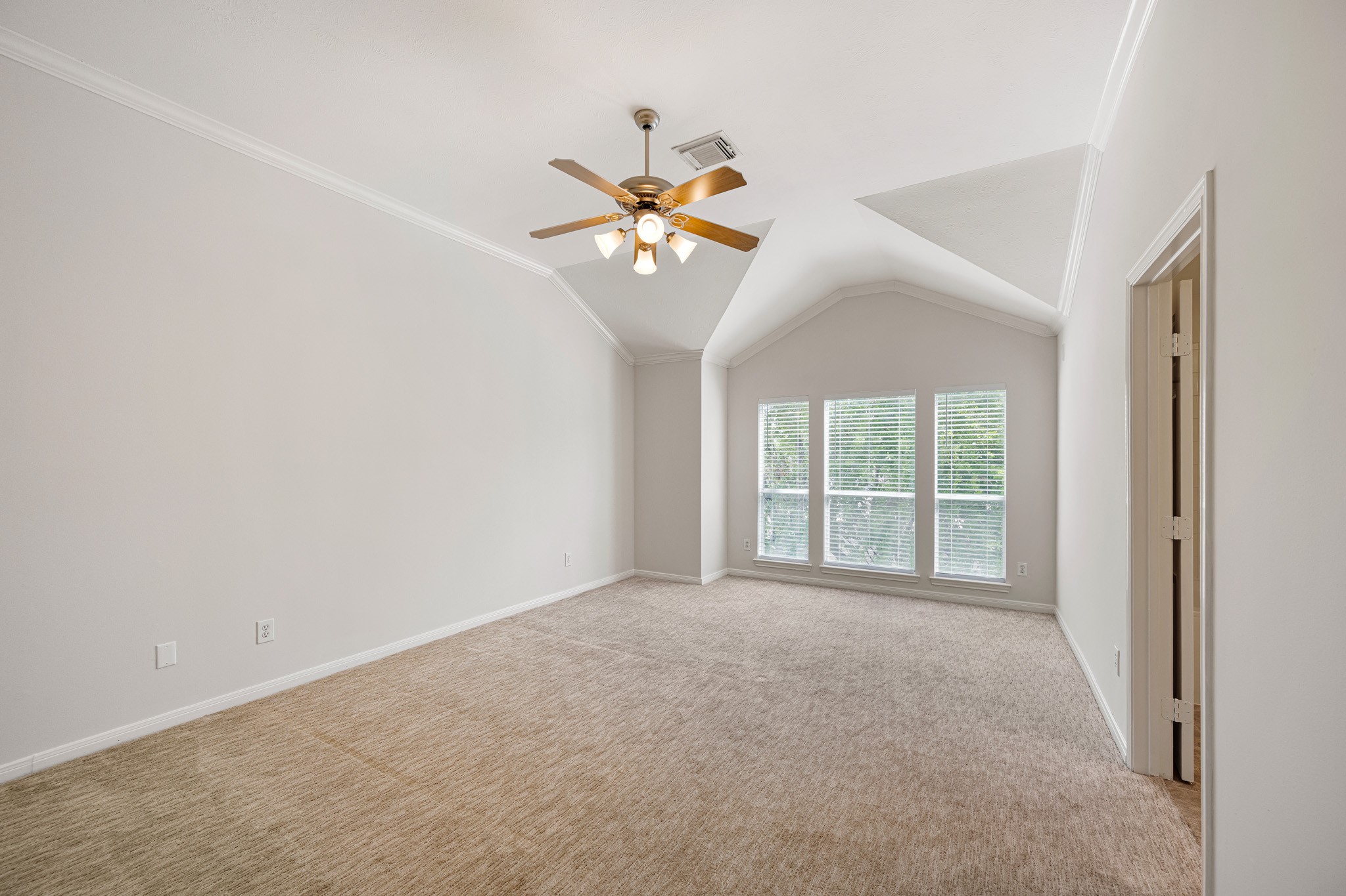 1727 Hadley Street Houston, TX 77003 - Photo 22 of 38 Gracious primary bedroom features designer carpet, fresh paint, ceiling fan and floor to ceiling windows.
