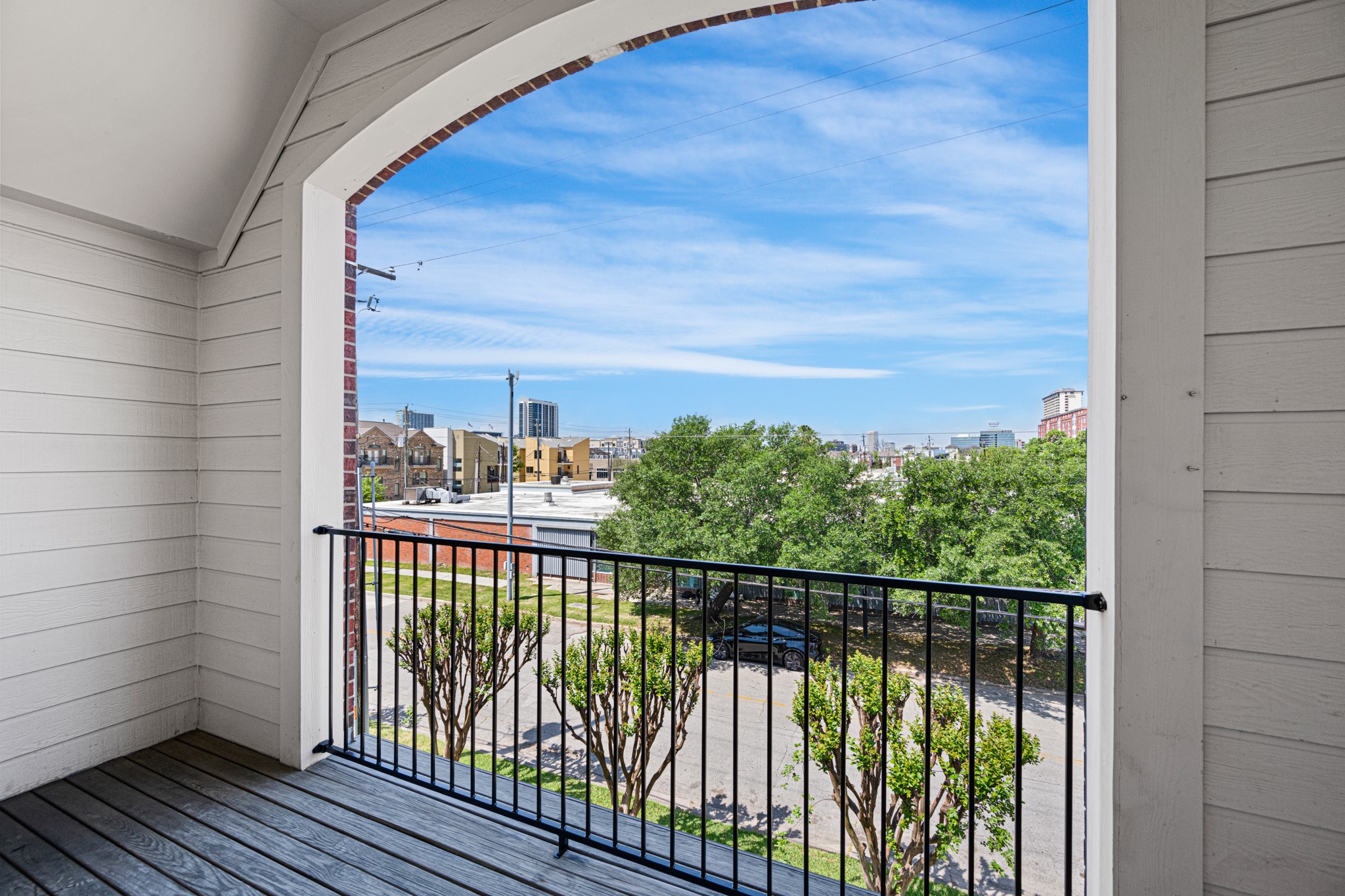 1727 Hadley Street Houston, TX 77003 - Photo 28 of 38 Third-floor covered balcony offering Houston skyline views—perfect for relaxing or entertaining.