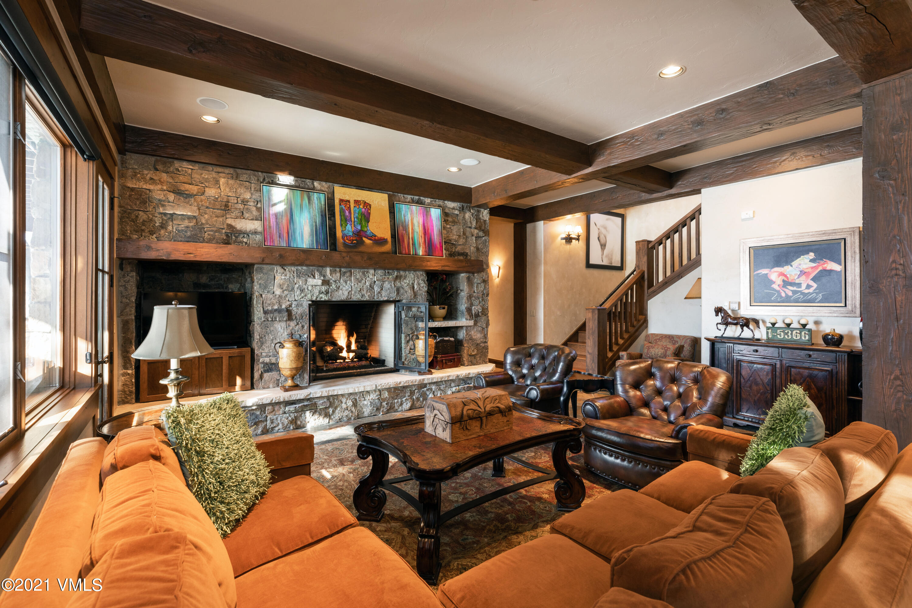 1092 Summit Trail Edwards, CO 81632 - Photo 13 of 48 a living room with furniture a large window and a fireplace