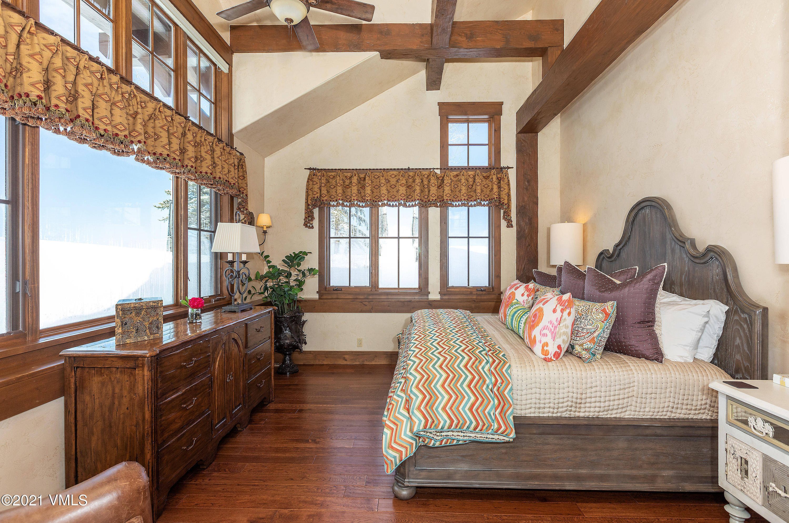 1092 Summit Trail Edwards, CO 81632 - Photo 15 of 48 a bedroom with a bed and wooden floor