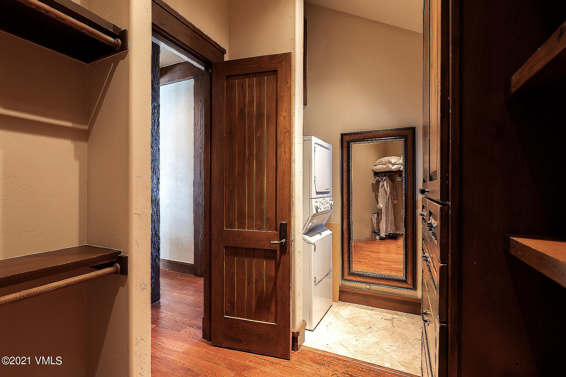 1092 Summit Trail Edwards, CO 81632 - Photo 16 of 48 a view of a hallway with wooden floor and staircase