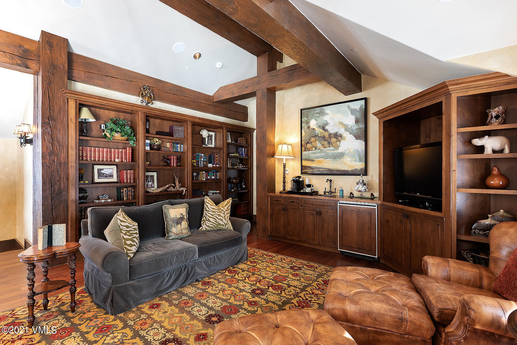 1092 Summit Trail Edwards, CO 81632 - Photo 21 of 48 a living room with furniture a flat screen tv and a floor to ceiling window