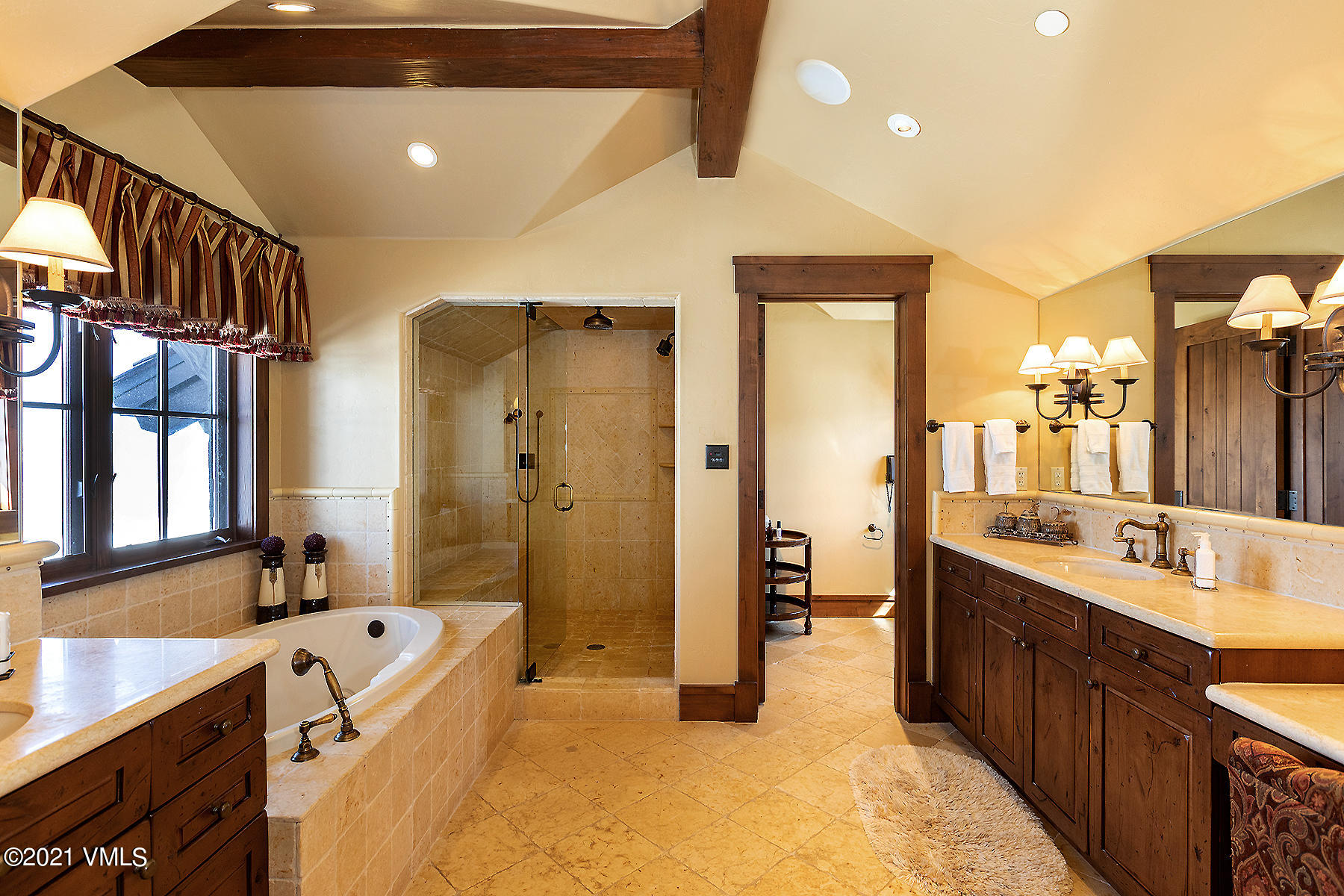 1092 Summit Trail Edwards, CO 81632 - Photo 24 of 48 a large bathroom with a large tub sink shower and mirror