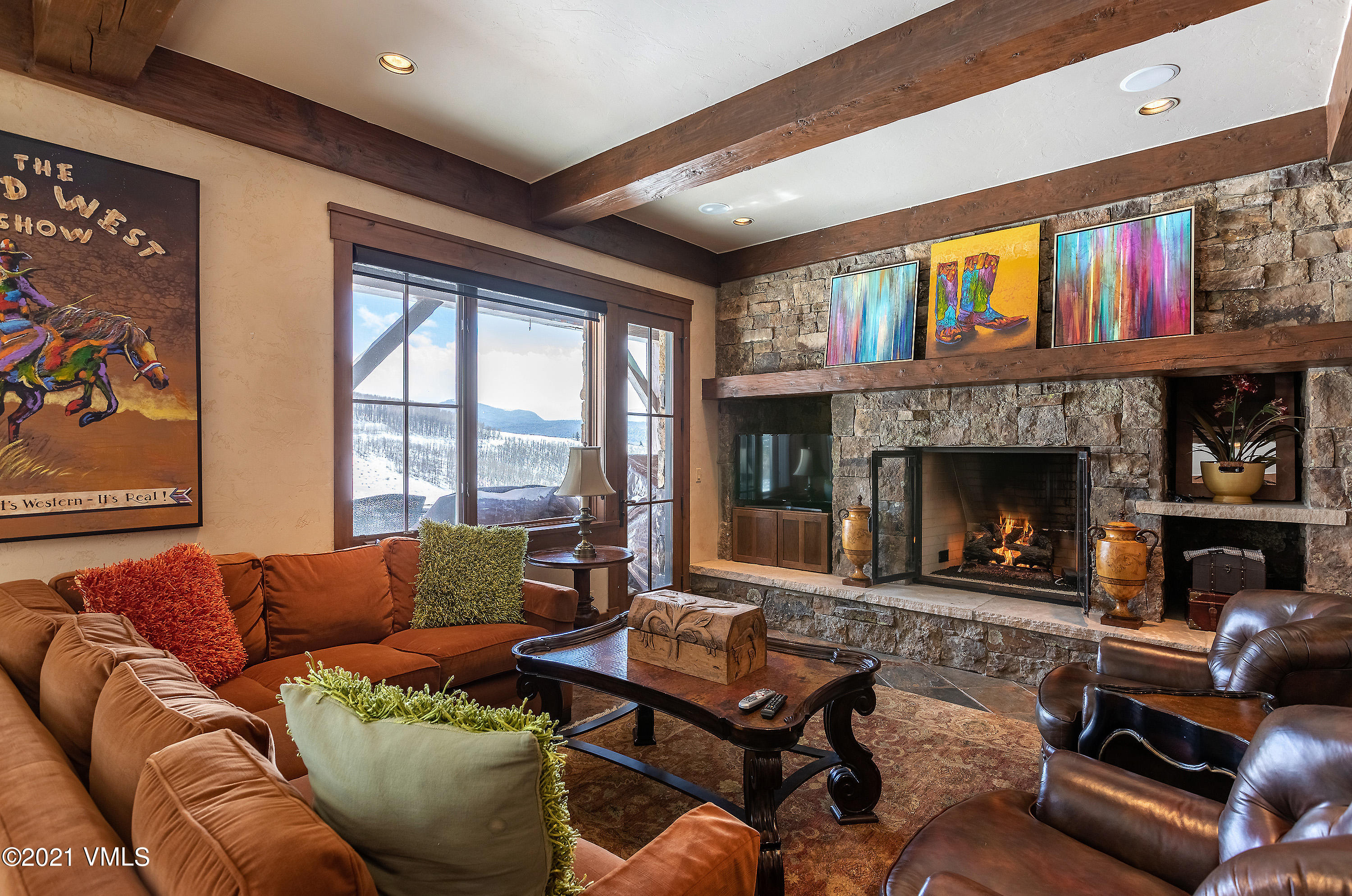 1092 Summit Trail Edwards, CO 81632 - Photo 27 of 48 a living room with furniture fireplace and a large window