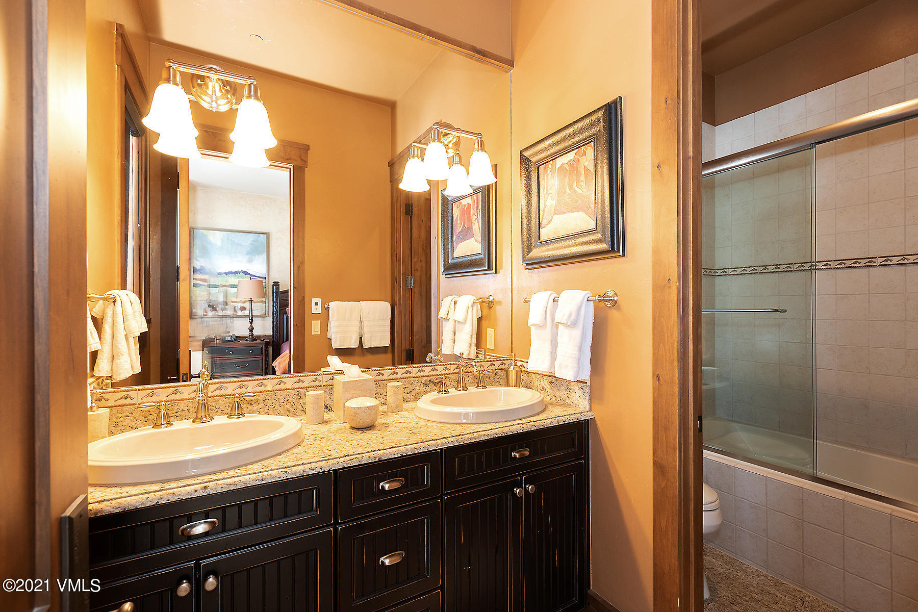 1092 Summit Trail Edwards, CO 81632 - Photo 37 of 48 a bathroom with a granite countertop sink mirror and