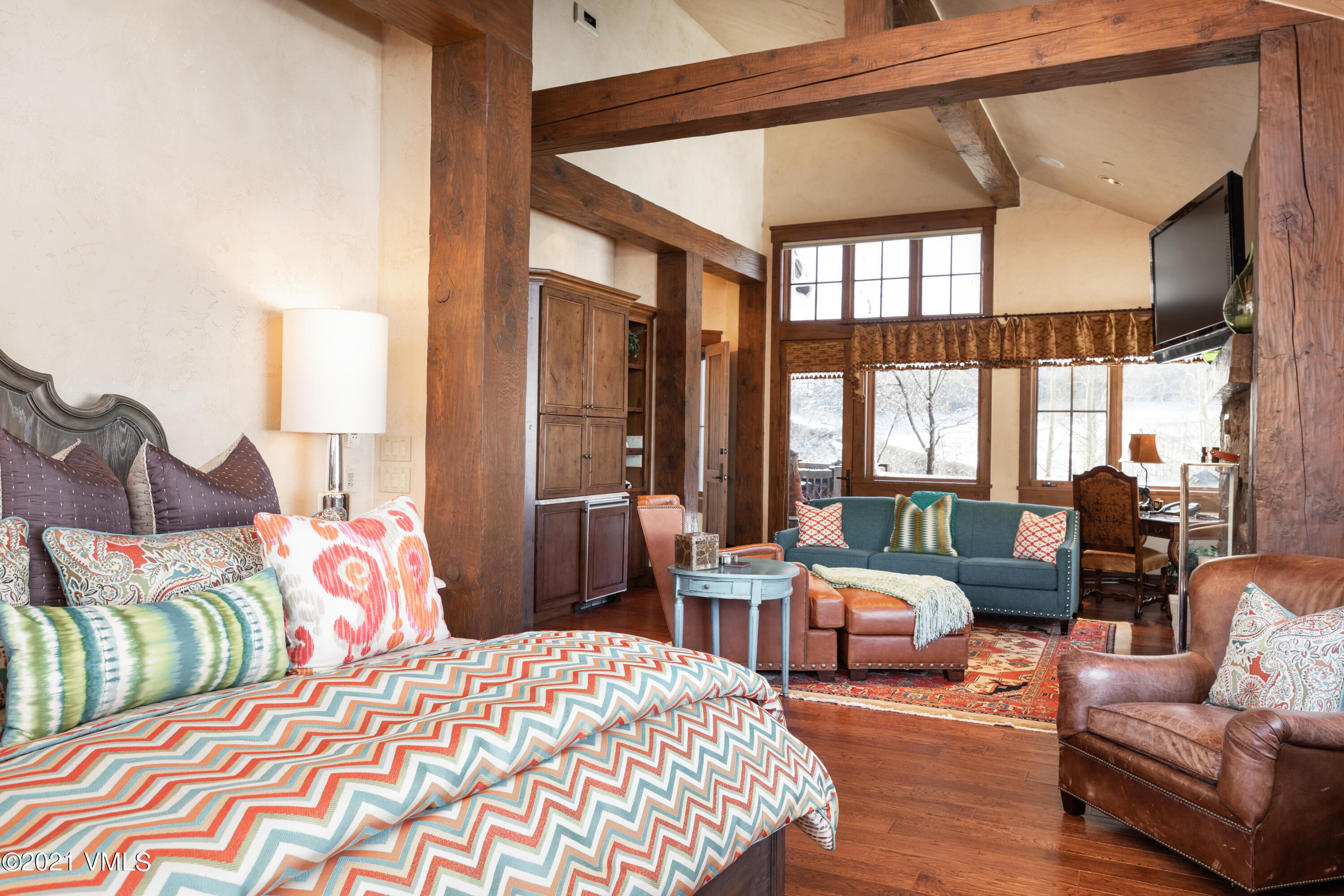 1092 Summit Trail Edwards, CO 81632 - Photo 45 of 48 a bedroom with a bed couch and a large window
