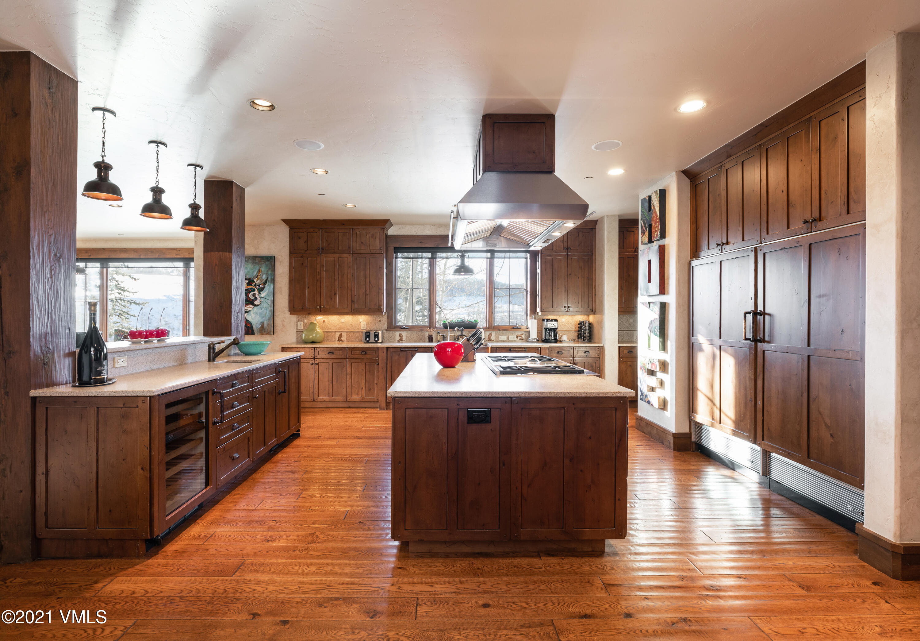 1092 Summit Trail Edwards, CO 81632 - Photo 5 of 48 a large kitchen with stainless steel appliances kitchen island granite countertop a large counter top and wooden floors