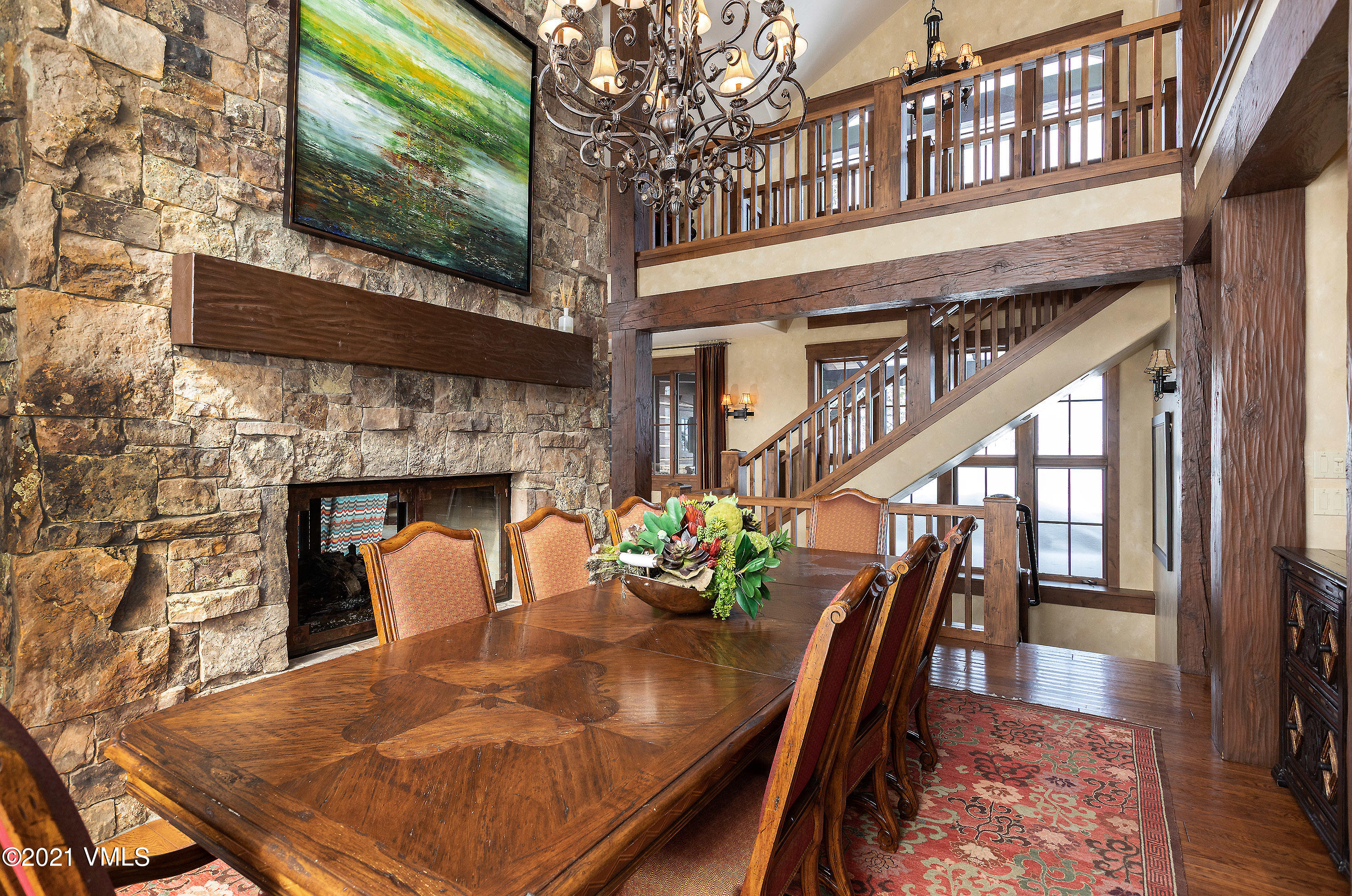 1092 Summit Trail Edwards, CO 81632 - Photo 8 of 48 a view of a dining room with furniture wooden floor and a fireplace