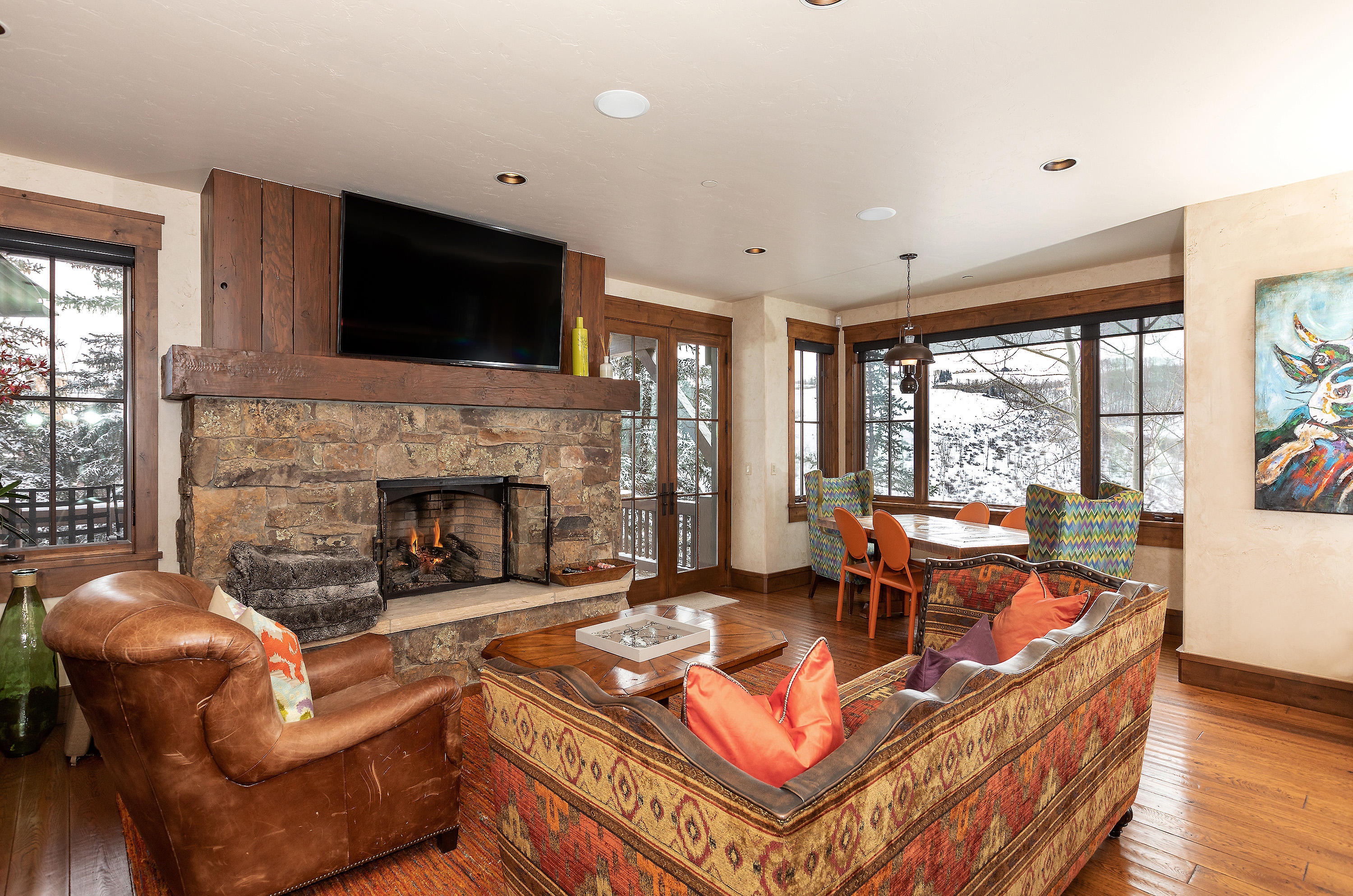 1092 Summit Trail Edwards, CO 81632 - Photo 9 of 48 a living room with furniture a flat screen tv and a fireplace