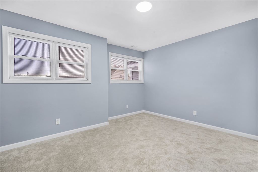 9 Quebec Street Springfield, MA 01151 - Photo 16 of 31 a view of an empty room with a window