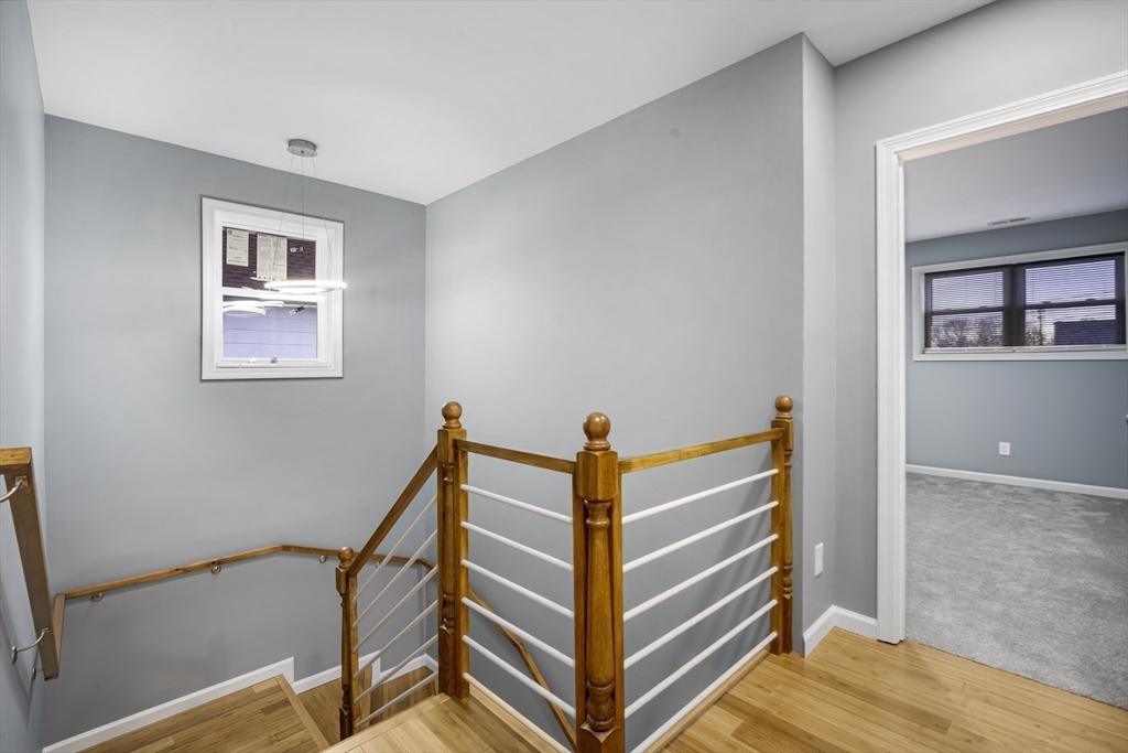 9 Quebec Street Springfield, MA 01151 - Photo 23 of 31 a view of entryway with stairs and wooden floor