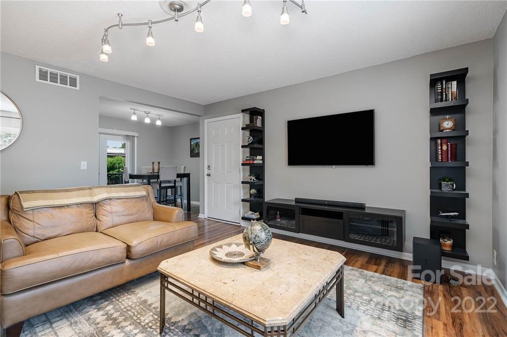 2612 Park Road, Unit D Charlotte, NC 28209 - Photo 3 of 23 a living room with furniture and a flat screen tv