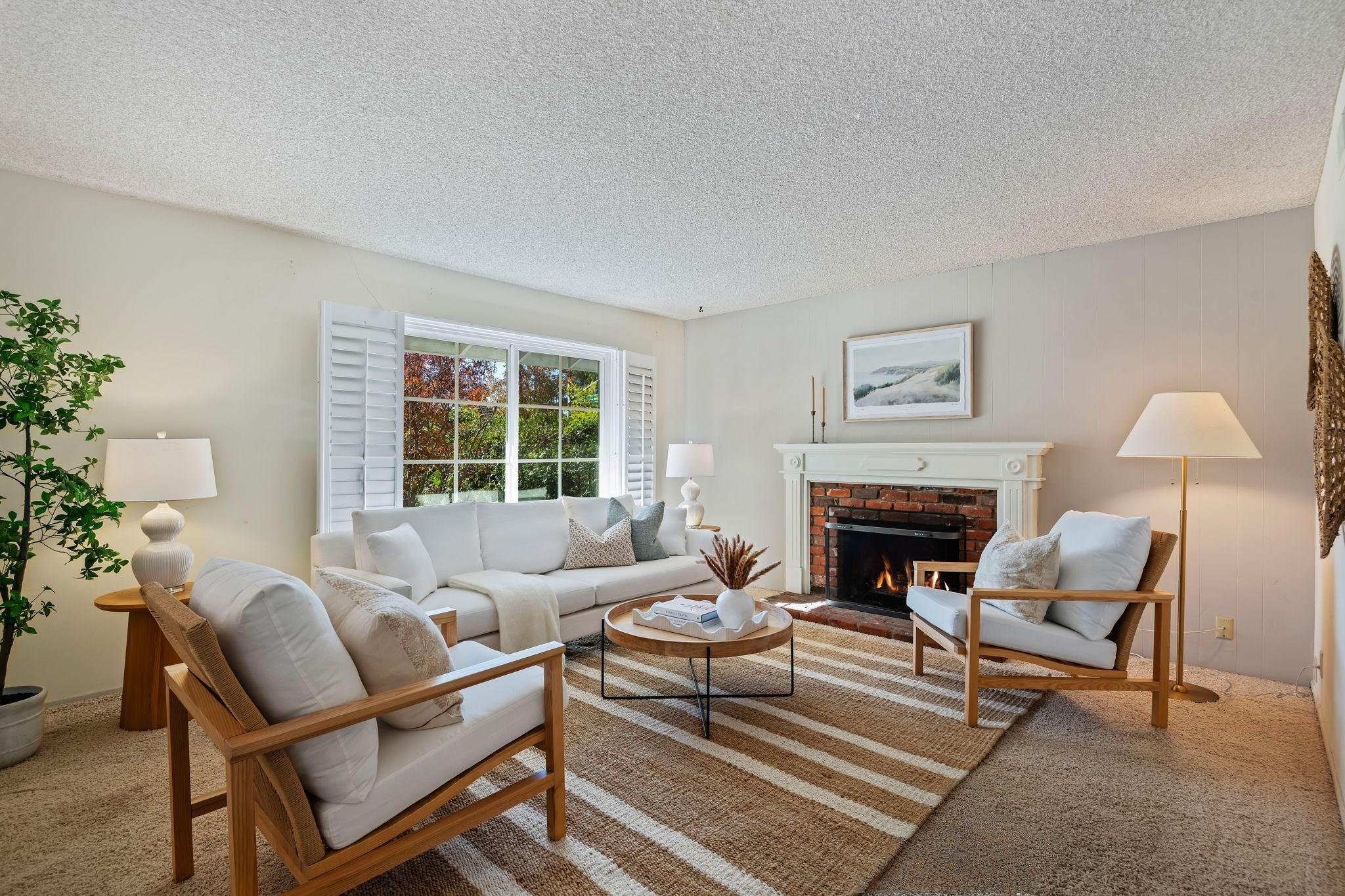 5984 Berkeley Road Goleta, CA 93117 - Photo 4 of 19 a living room with furniture and a fireplace