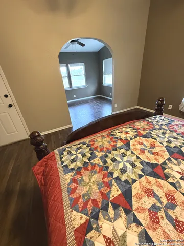 a bedroom with a bed and a dresser