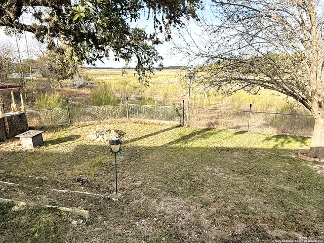 a view of a yard with an outdoor space