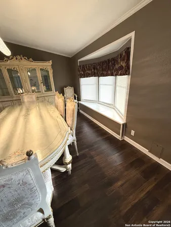 a dining room with wooden floor