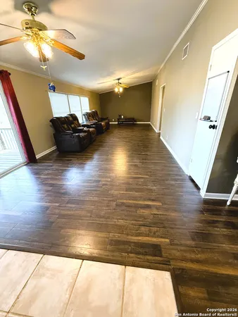 a view of room with wooden floor