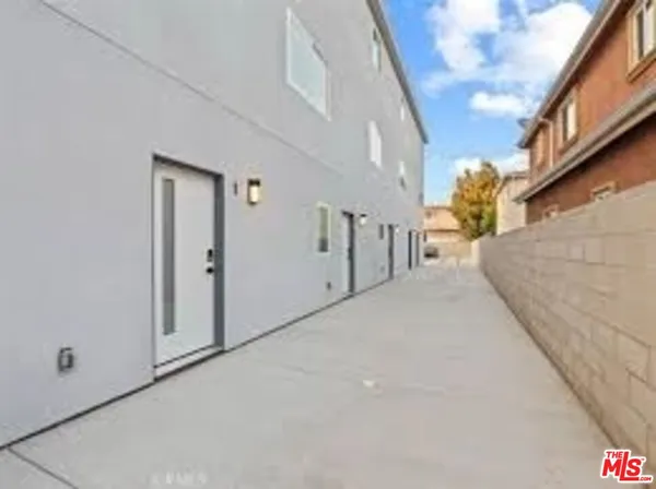 a view of a house with a street