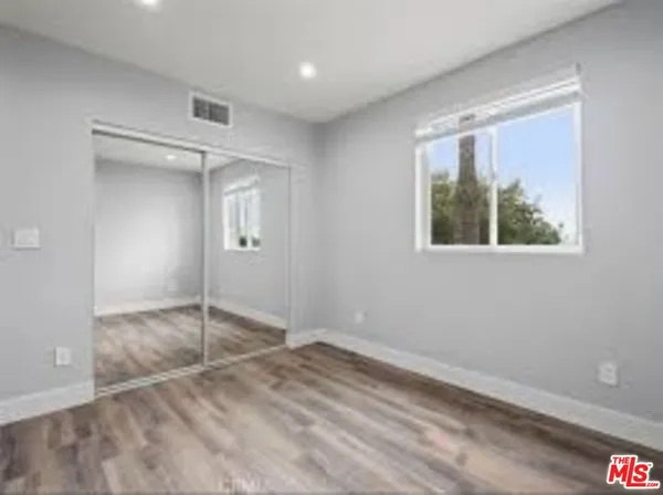 an empty room with a empty space and windows