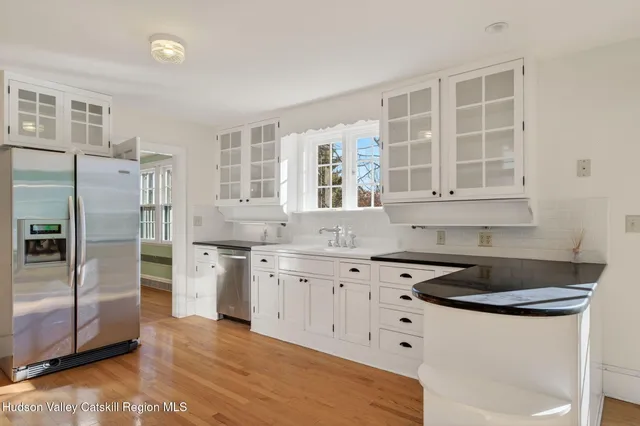 a view of an entryway with wooden floor
