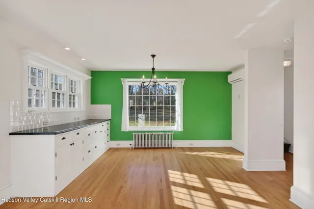 a room with window and cabinet