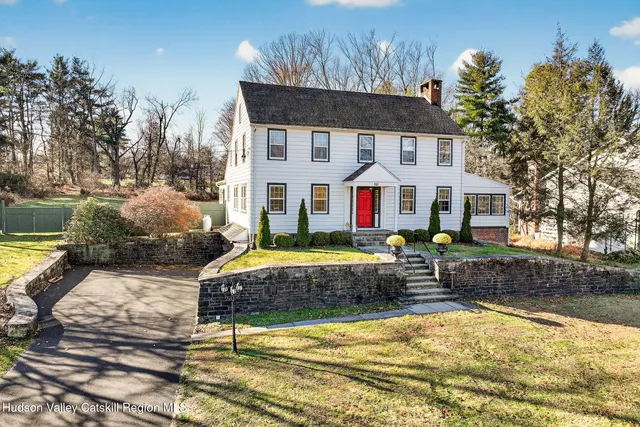 a front view of house with yard outdoor seating and barbeque oven