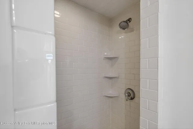 a view of a hallway with a washer and dryer