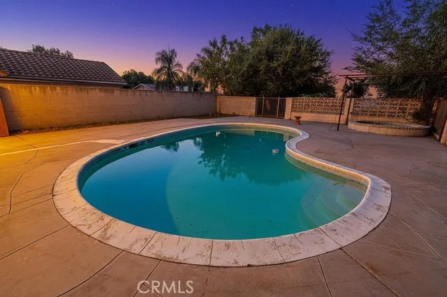 a view of swimming pool with a yard