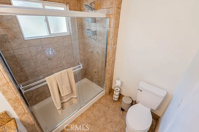 a house with yard and a wooden fence