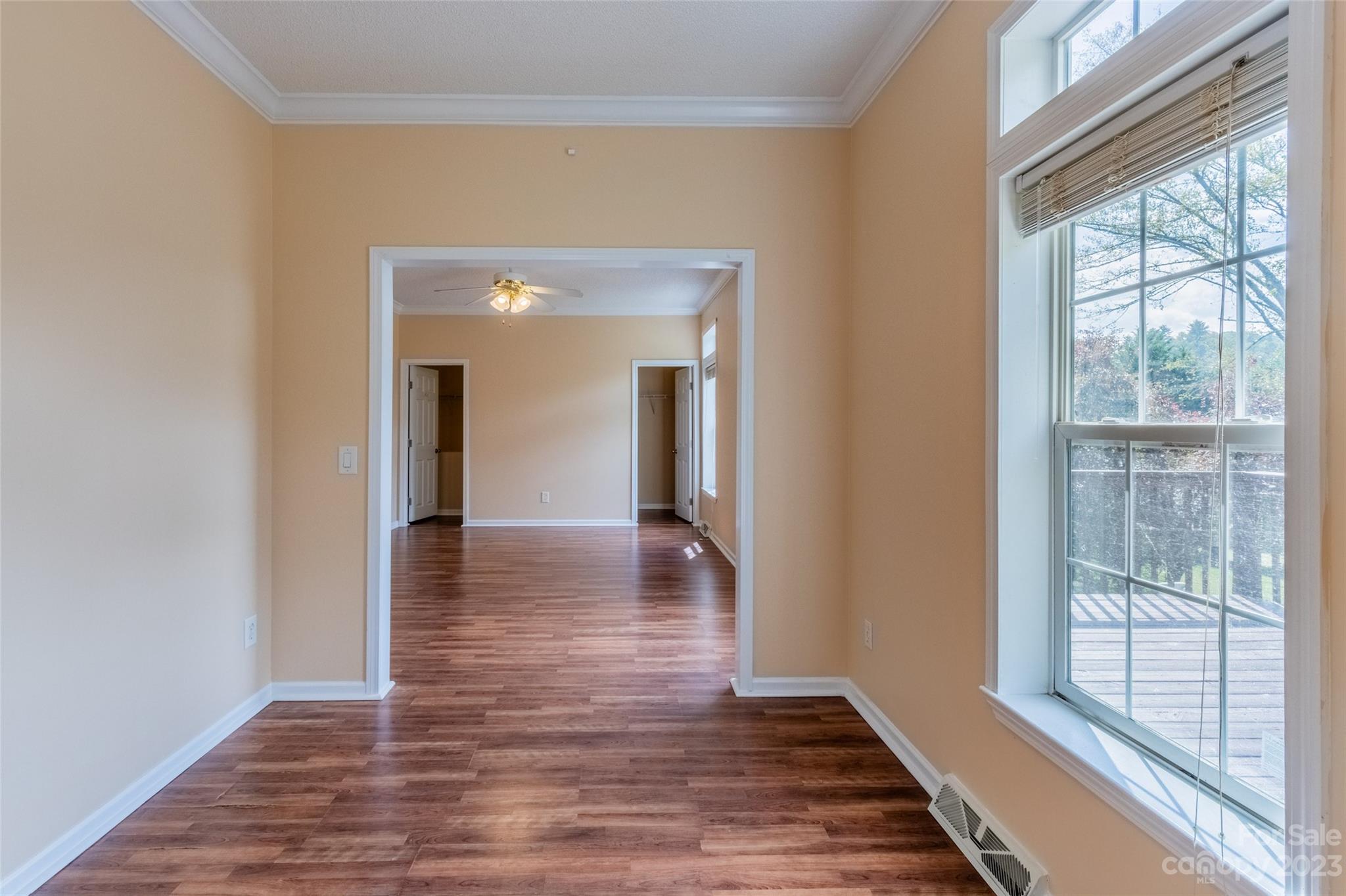 407 Monteith Gap Road Cullowhee, NC 28723 - Photo 17 of 27 a view of a hallway view with wooden floor and windows