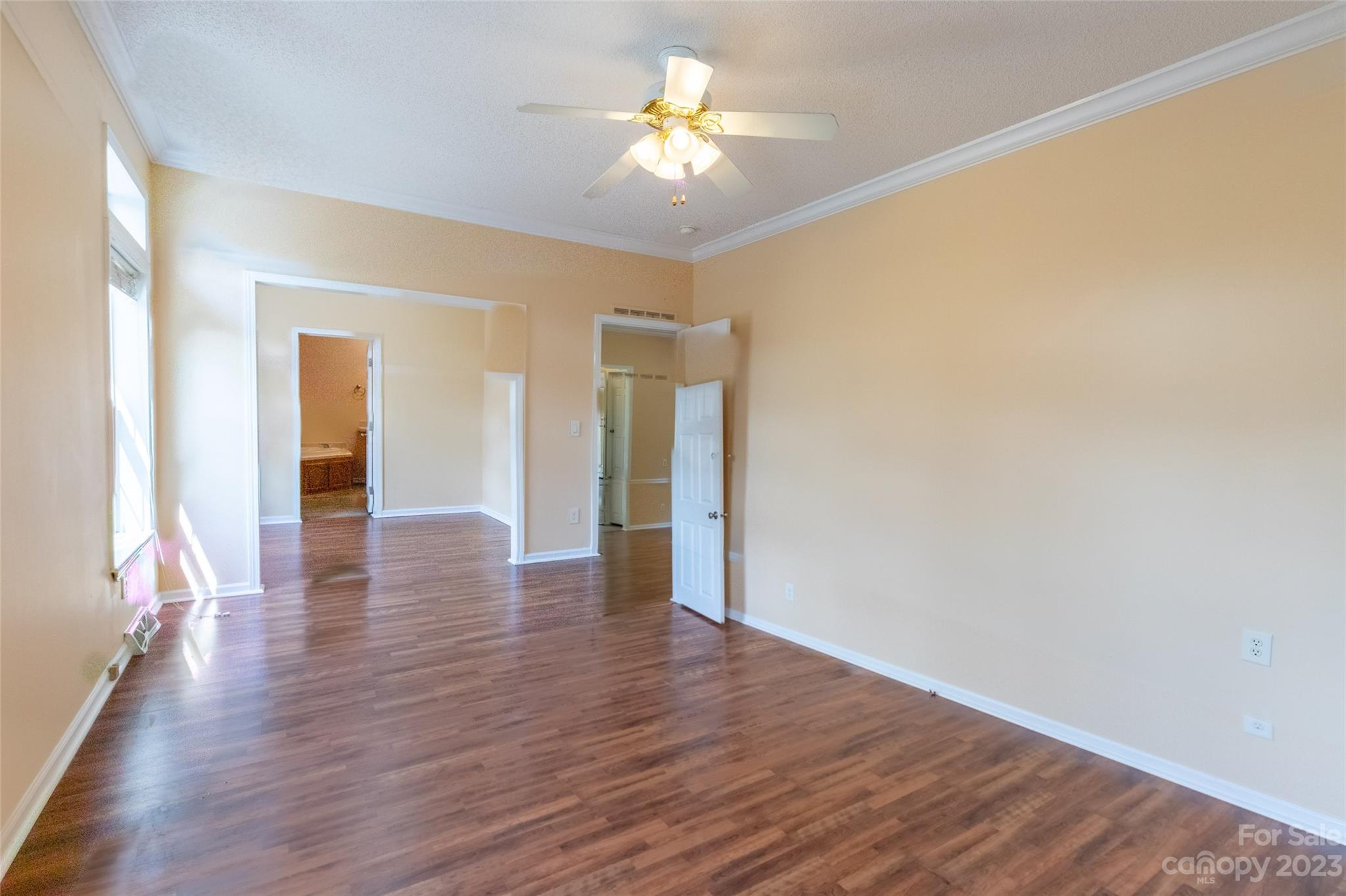 407 Monteith Gap Road Cullowhee, NC 28723 - Photo 18 of 27 a view of an empty room with window and wooden floor