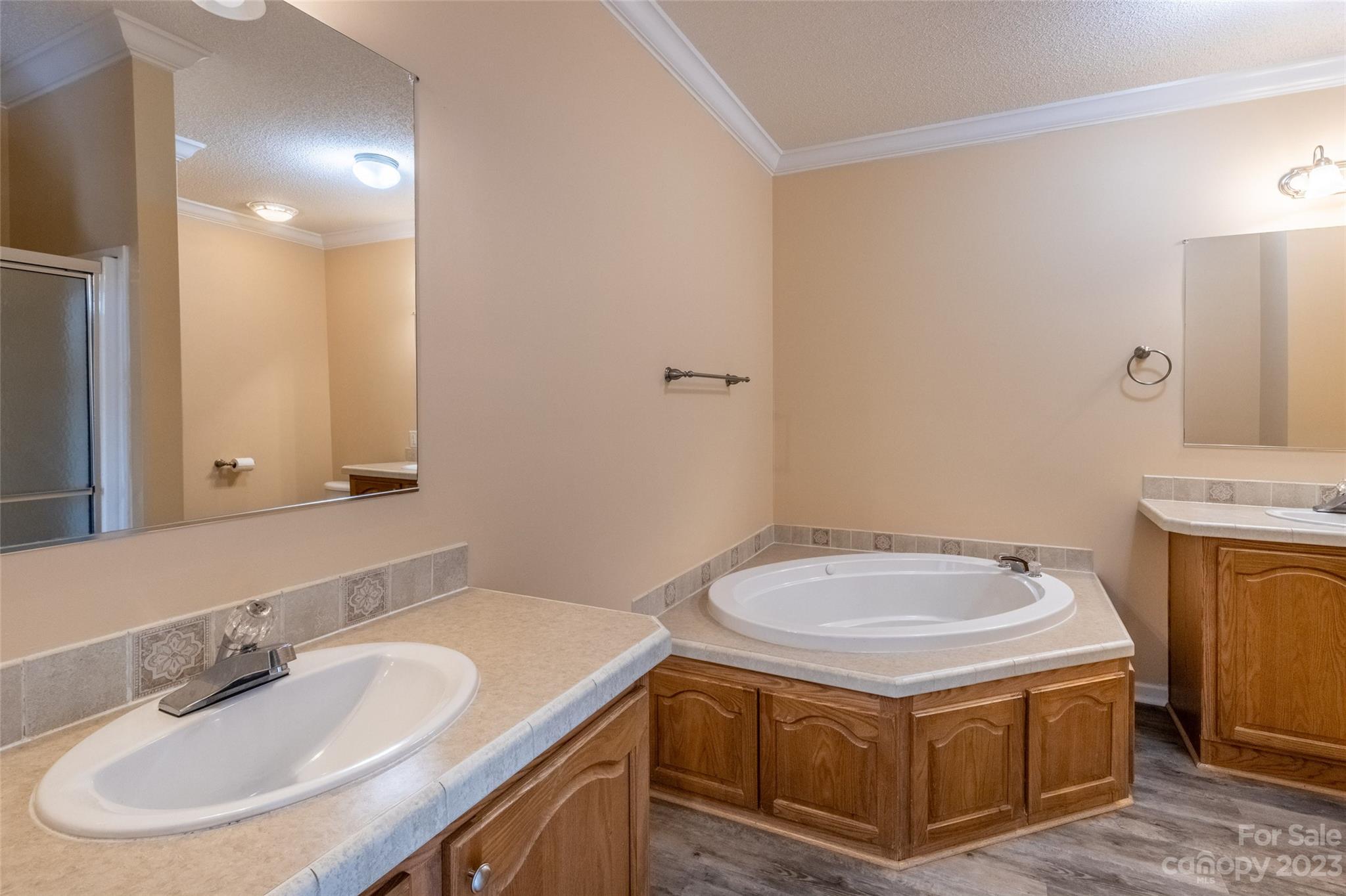 407 Monteith Gap Road Cullowhee, NC 28723 - Photo 20 of 27 a bathroom with a sink a toilet and a mirror