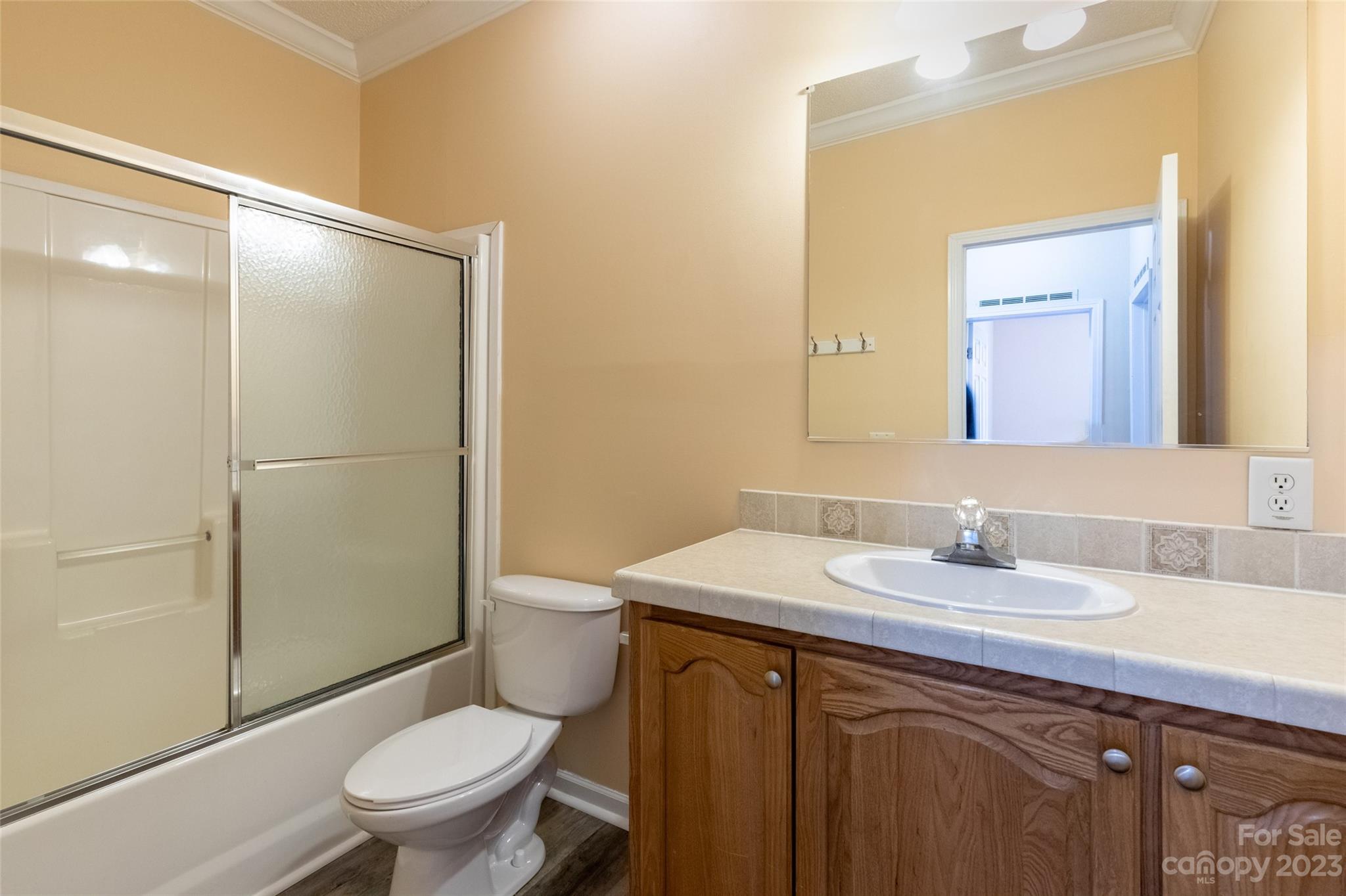407 Monteith Gap Road Cullowhee, NC 28723 - Photo 24 of 27 a bathroom with a toilet a sink and shower