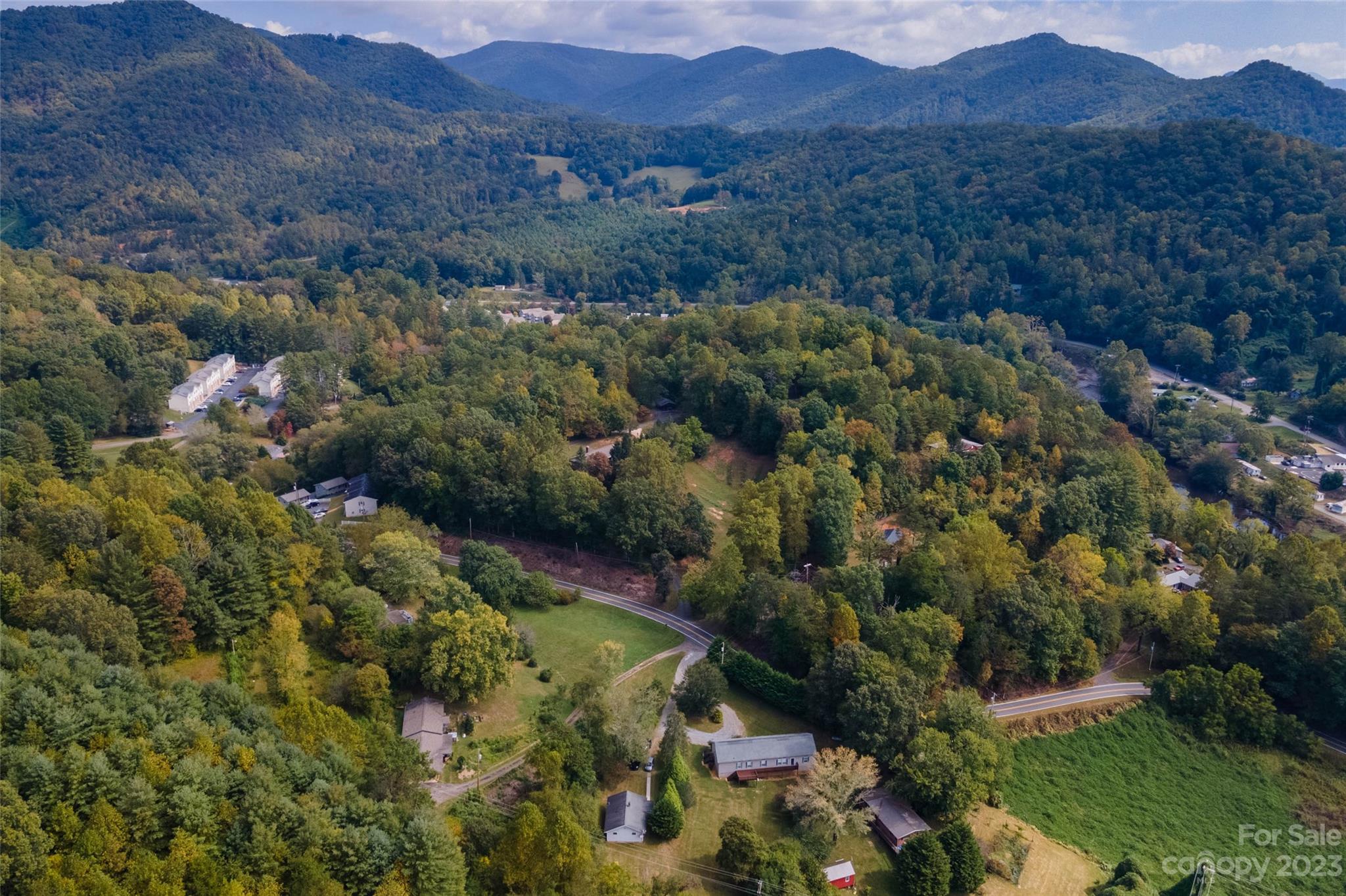 407 Monteith Gap Road Cullowhee, NC 28723 - Photo 26 of 27 an aerial view of residential house with outdoor space and trees all around