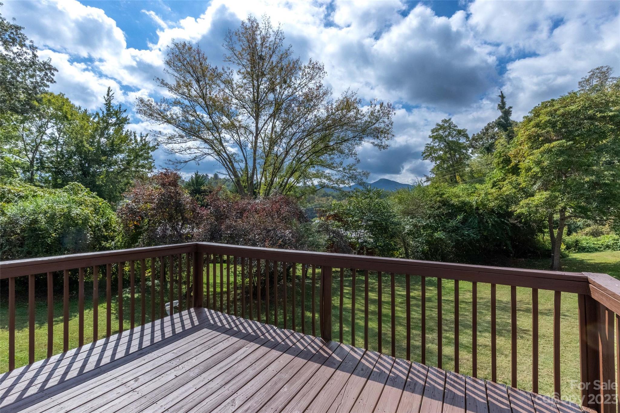 407 Monteith Gap Road Cullowhee, NC 28723 - Photo 7 of 27 a view of balcony with wooden floor and fence