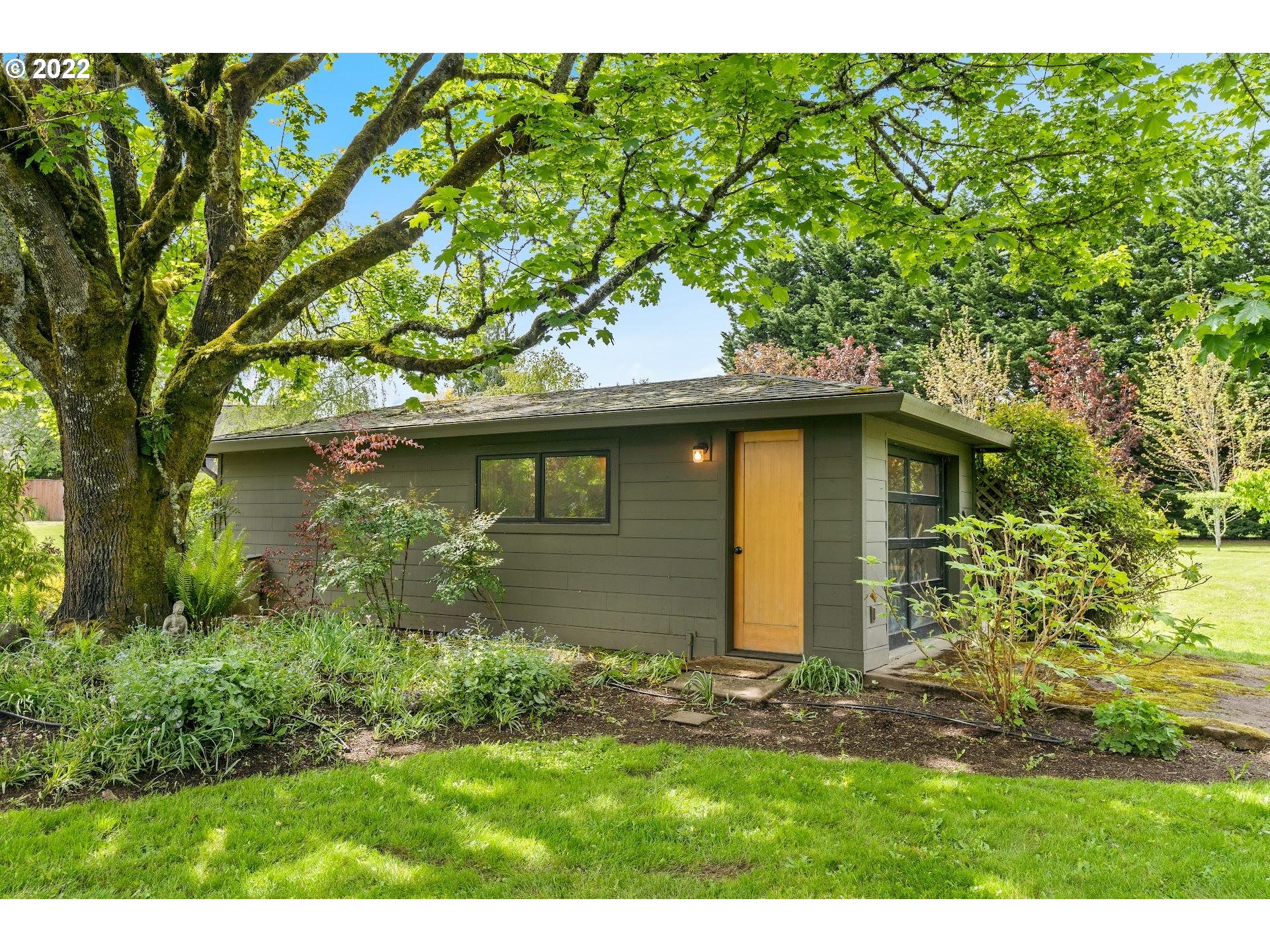 18131 Northwest Reeder Road Portland, OR 97231 - Photo 22 of 31 a view of a house with a yard