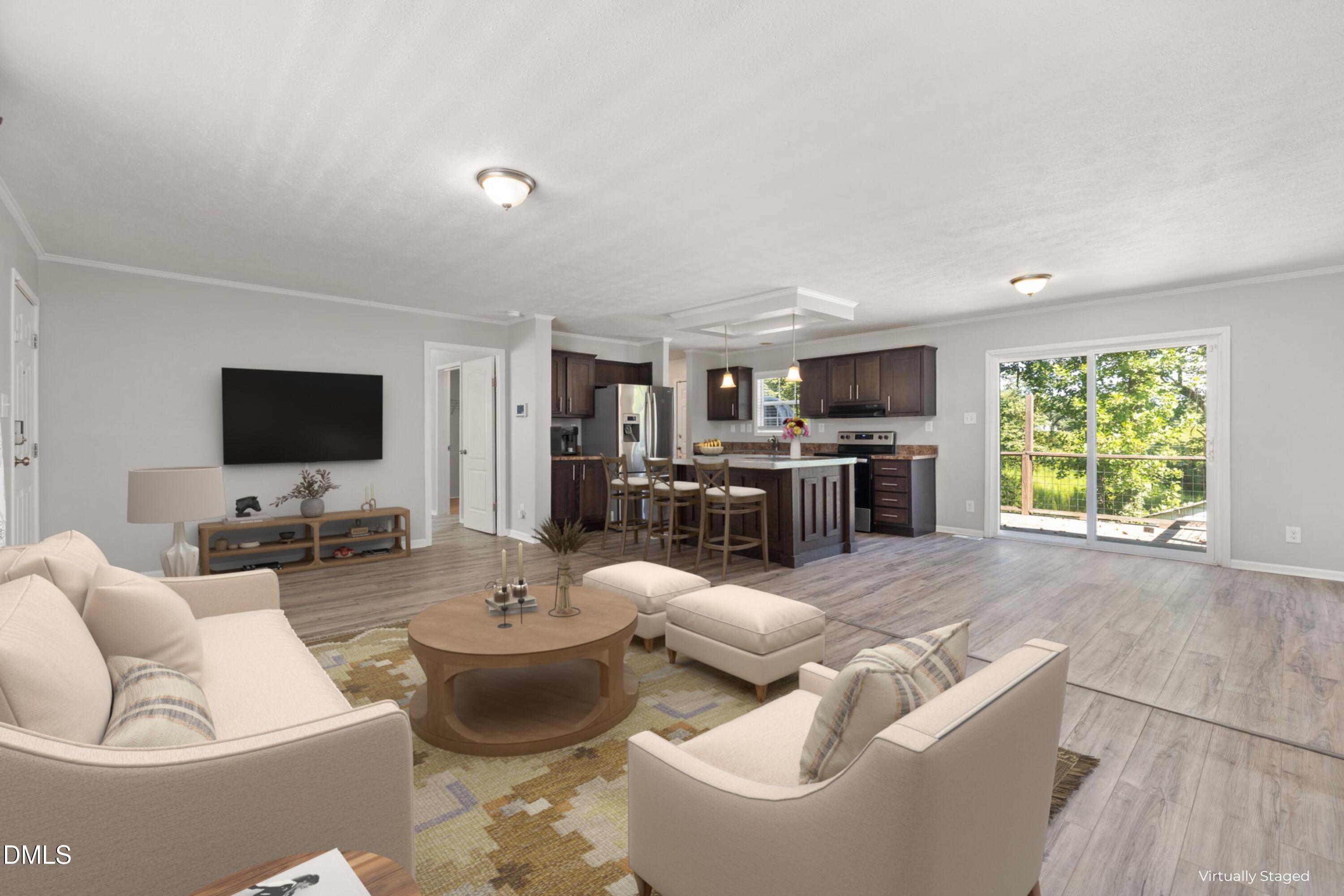 a living room with furniture and a flat screen tv