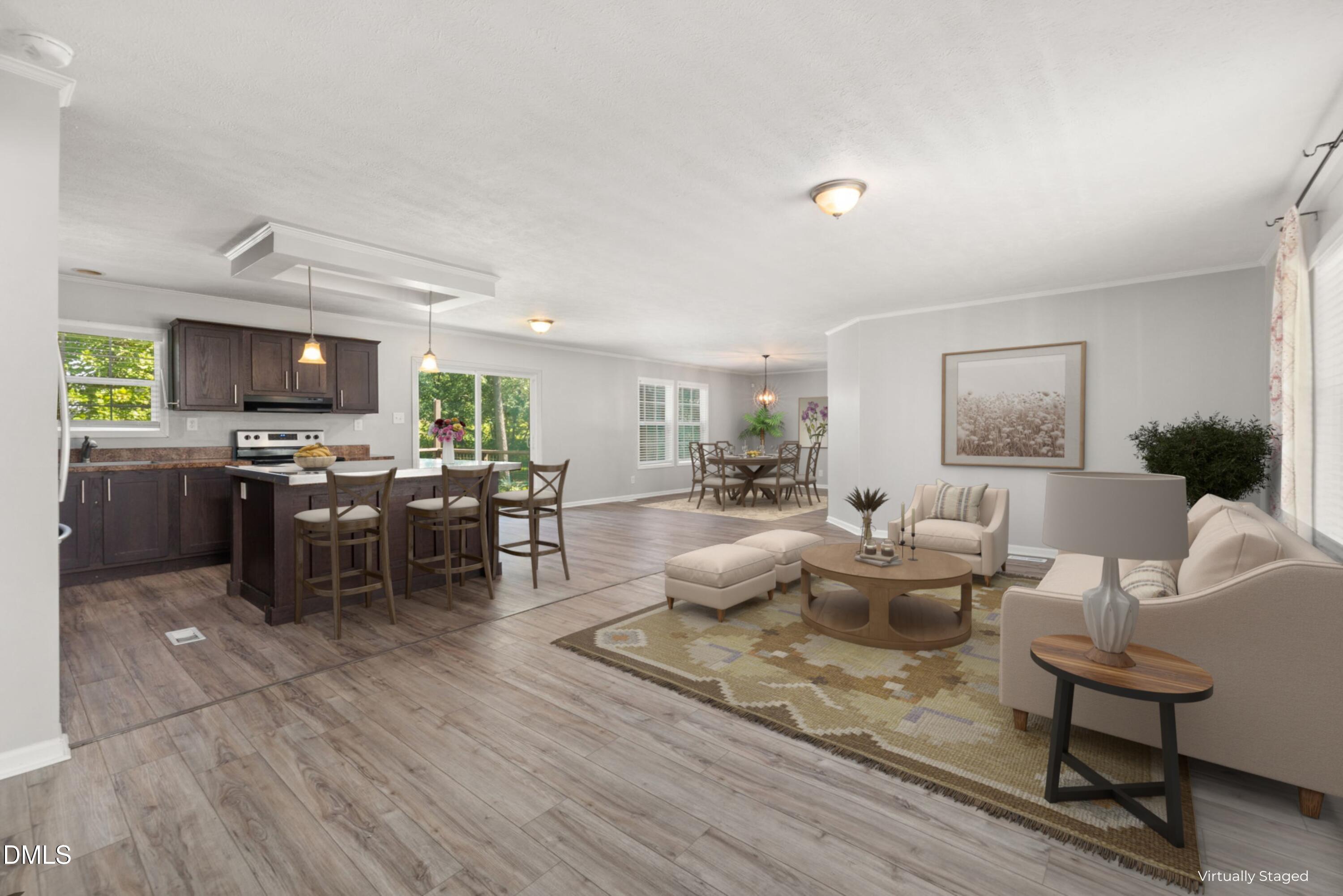 4073 Pine Ridge Road Franklinton, NC 27525 - Photo 1 of 24 a living room with lots of furniture and kitchen view