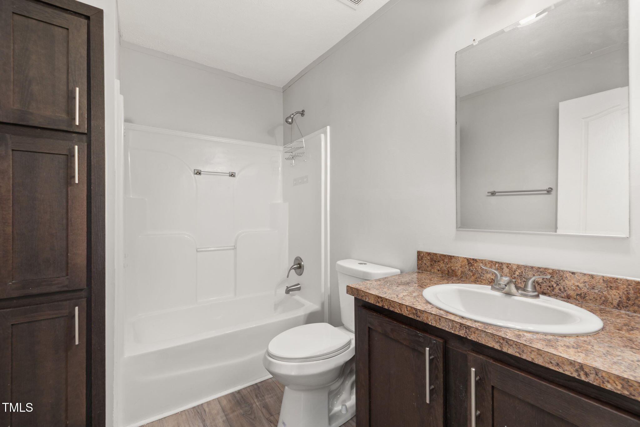 4073 Pine Ridge Road Franklinton, NC 27525 - Photo 11 of 24 a bathroom with a granite countertop sink toilet and shower
