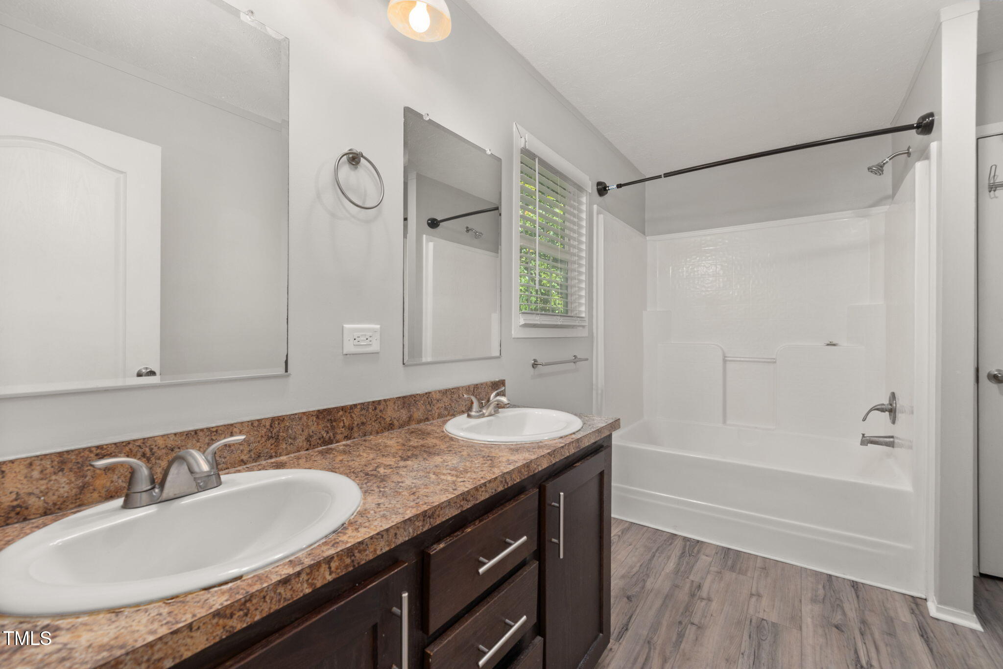 4073 Pine Ridge Road Franklinton, NC 27525 - Photo 17 of 24 a bathroom with a granite countertop sink mirror and a bathtub