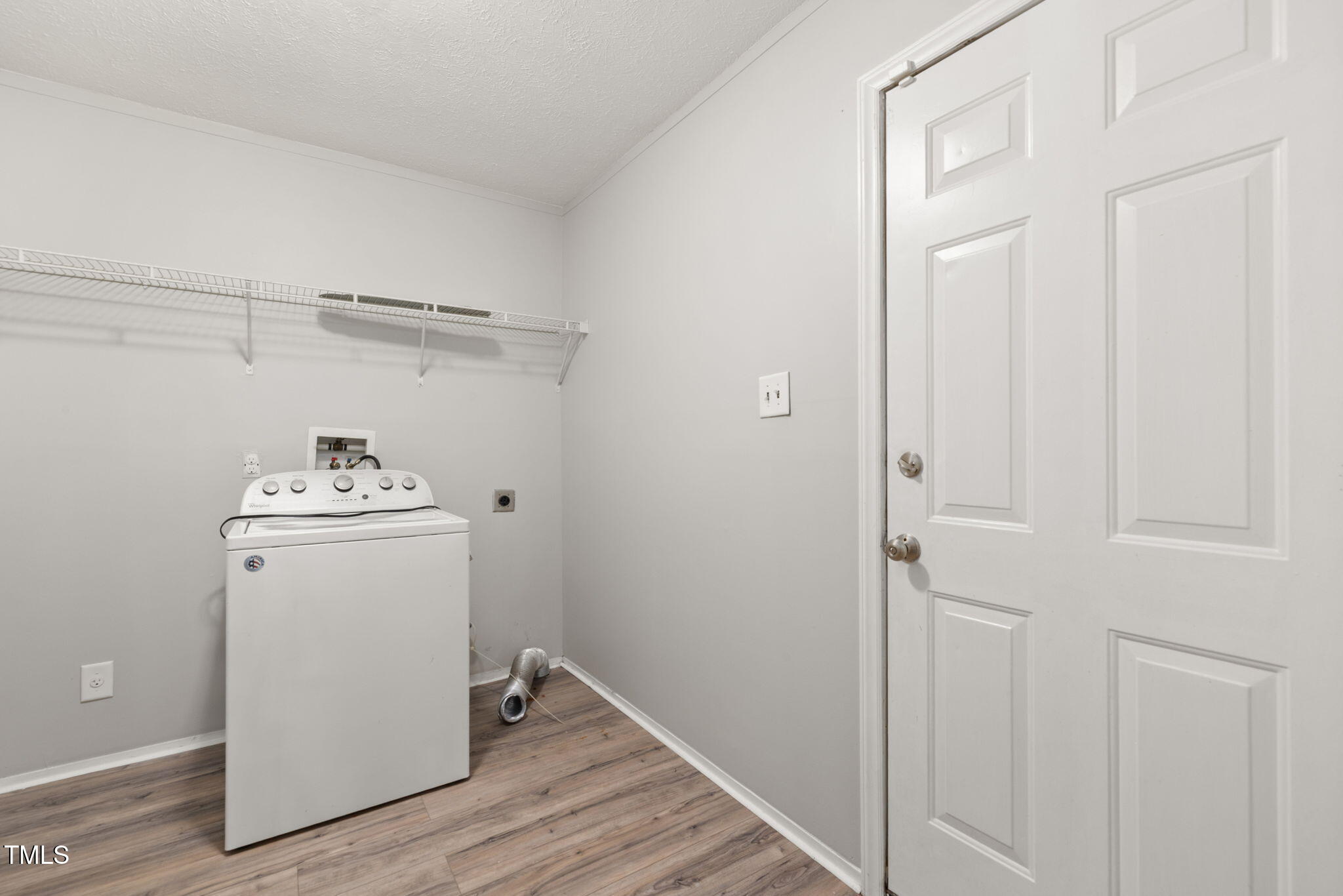 4073 Pine Ridge Road Franklinton, NC 27525 - Photo 19 of 24 a utility room with wooden floor washer and dryer