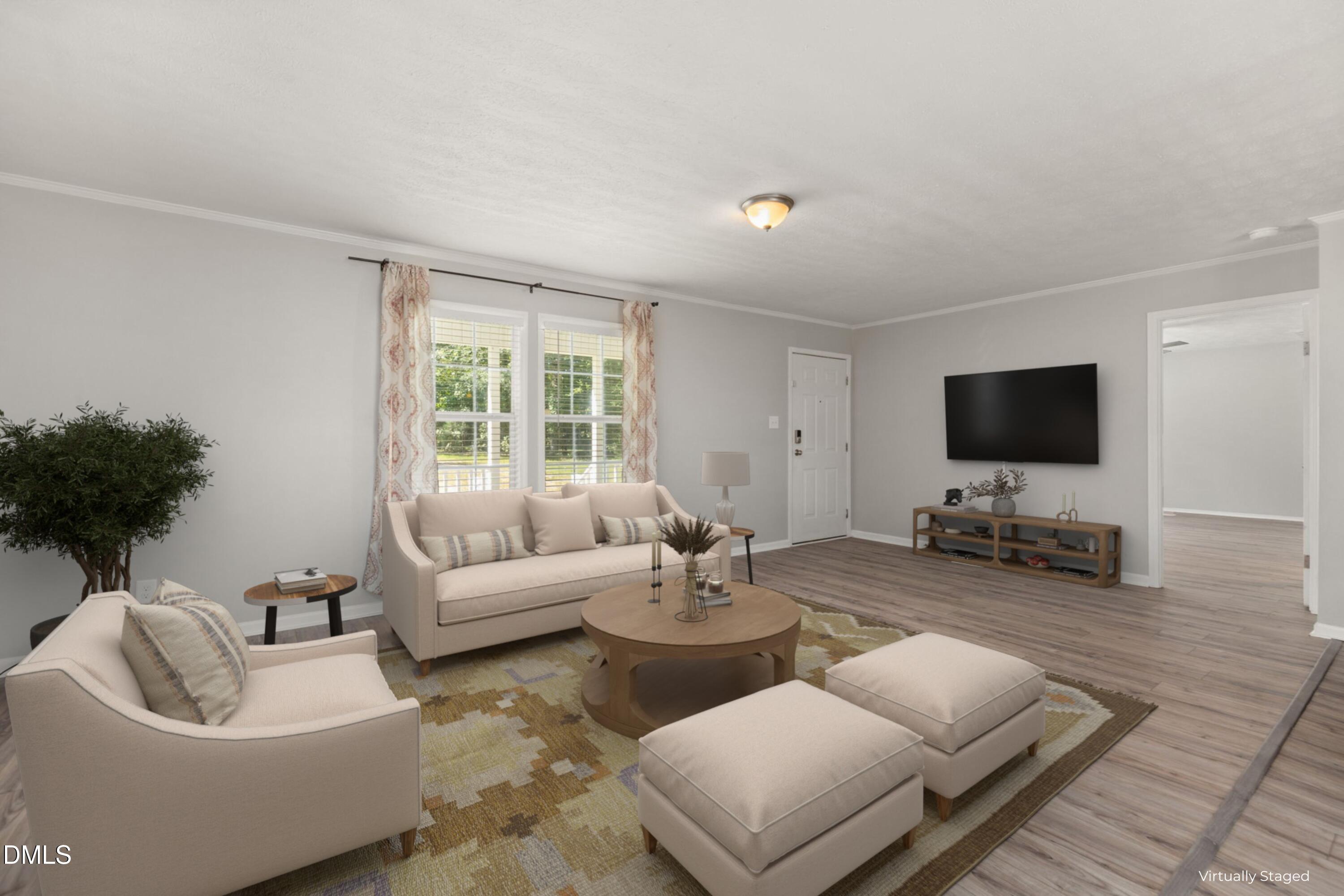 4073 Pine Ridge Road Franklinton, NC 27525 - Photo 2 of 24 a living room with furniture and a flat screen tv