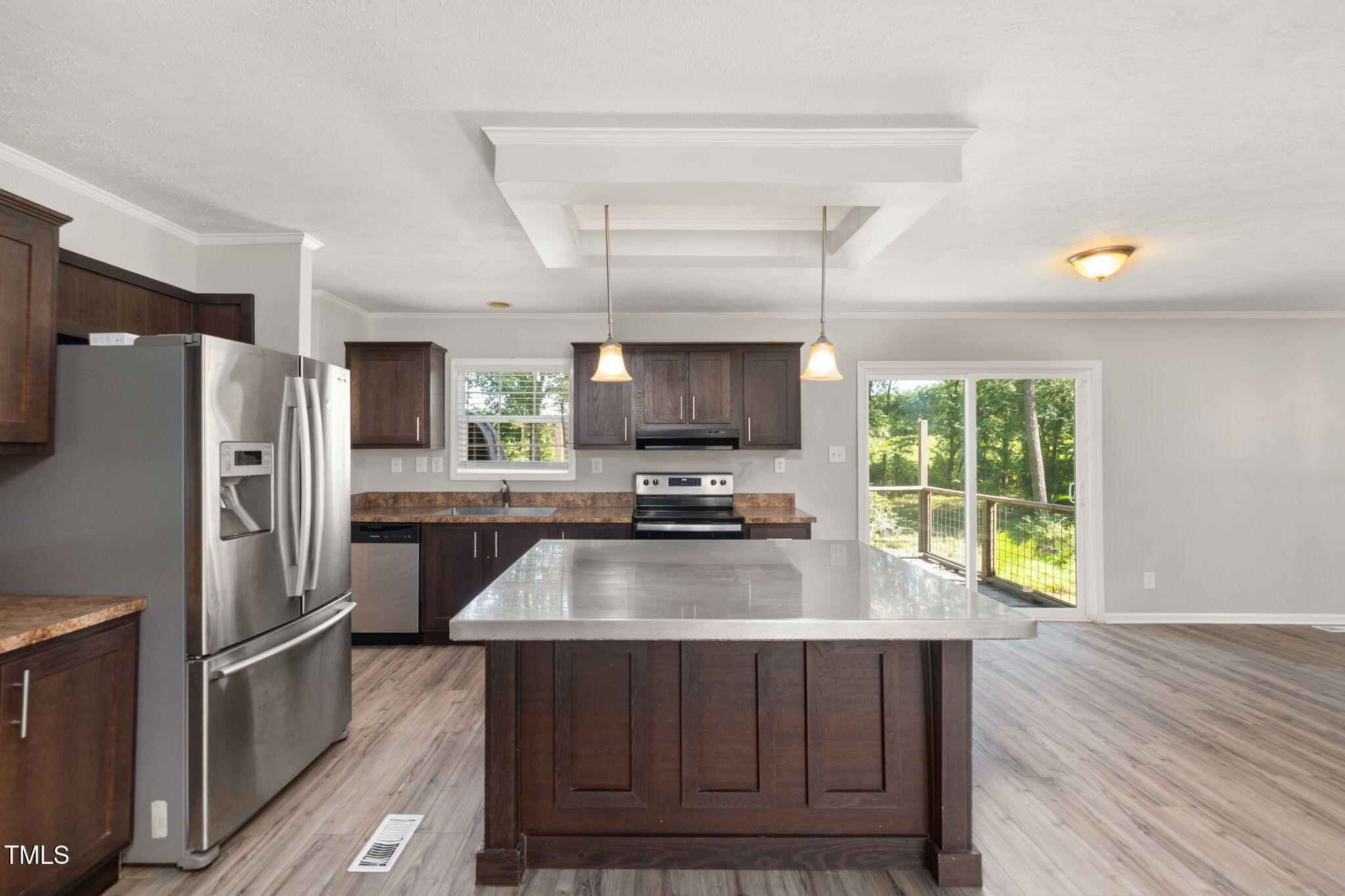 4073 Pine Ridge Road Franklinton, NC 27525 - Photo 4 of 24 a kitchen with a refrigerator and a sink